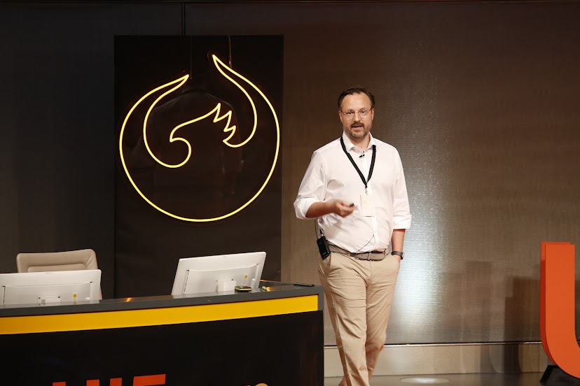 Mike Zaschka — speaking on stage at an SAP developer conference